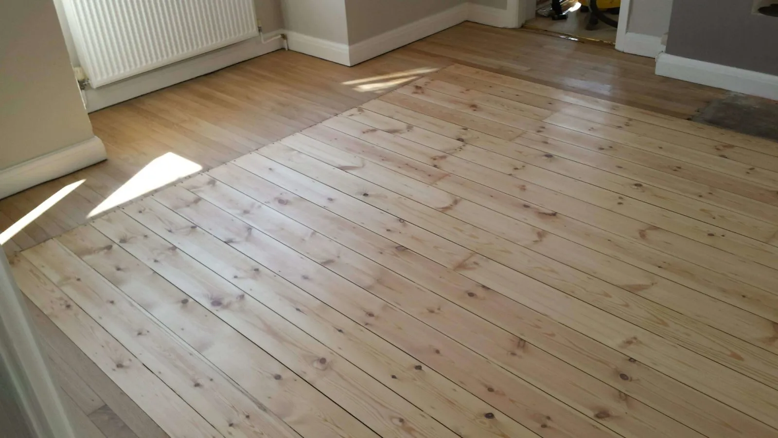 Floor 7. Pine Flloorboards with Solid Oak Planking Border - Before